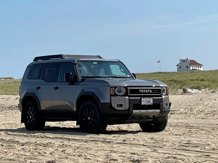 LC on Beach with House - Desktop Version.webp